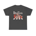 Dunkelgraues T Shirt mit spaßigem Printmotiv. Vier Cartoon Dinosaurier parodieren das ikonische Beatles Abbey Road Cover auf einem Zebrastreifen.